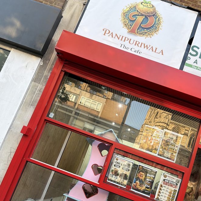 The red shopfront and sign on Station Road