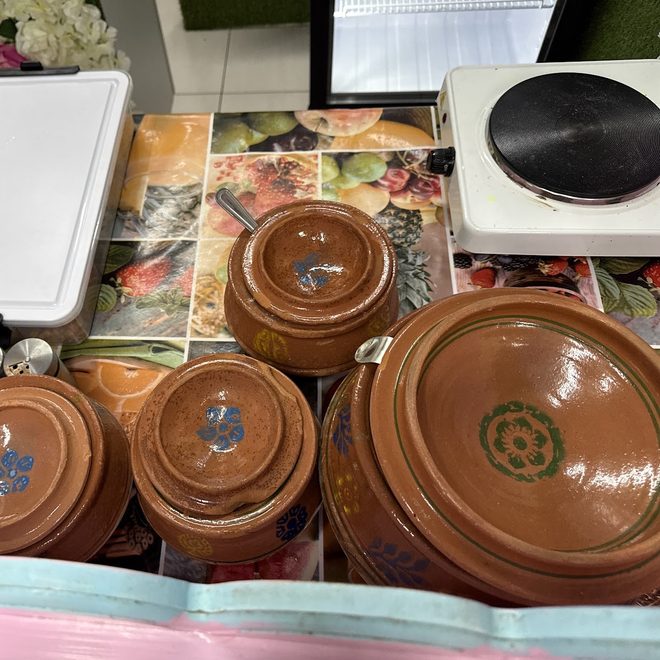 Clay matkas lined up on the counter