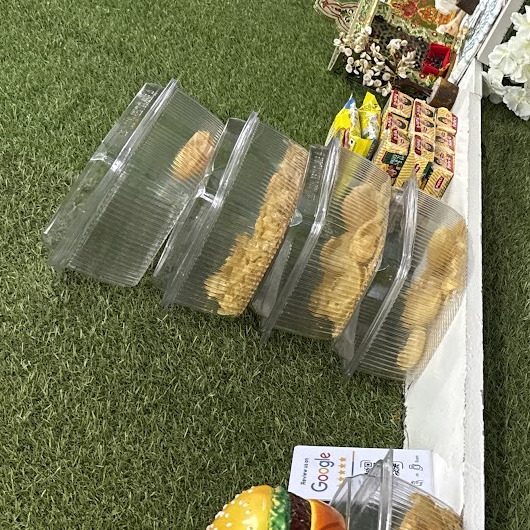 Boxes of puris on the shelf inside PANIPURIWALA